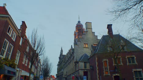 Traditional-European-Dutch-style-cathedral-chapel-and-houses-with-architecture-buildings-in-Netherlands-and-authentic-art-design,-sightseeing-sunset-walkthrough