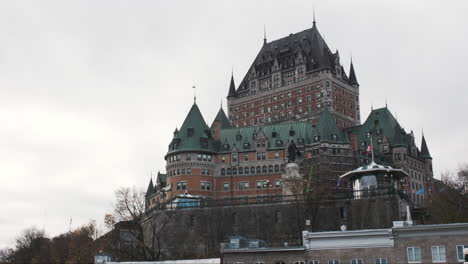 Looking-up-at-the-historic-Fairmont-Le-Chateau-Frontenac-against-an-overcast-sky