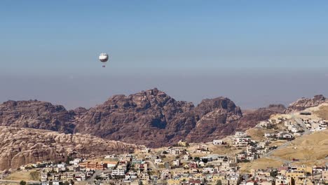 Tourists-ride-a-hot-air-balloon-over-Petra-in-Wadi-Musa,-Jordan