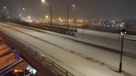 Group-of-Snow-Plow-Trucks-Removing-Snow-and-Ice-from-Canadian-Highway