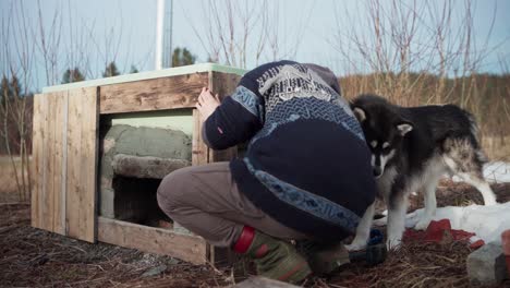 Male-Builder-Doing-His-DIY-Hot-Tub-Outdoors---Close-Up