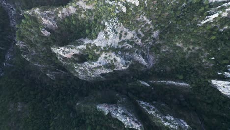 Aerial-drone-tops-down-mountains-of-Copper-Canyon-mexican-rocky-formations-with-Trees,-Mexico-travel-hiking-destination,-Chihuahua-in-Sierra-Madre-Occidental-panoramic-landscape