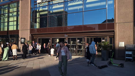 Oslo-Central-Station-Exterior,-People-Going-In-and-Out-on-Sunny-Day,-Norway