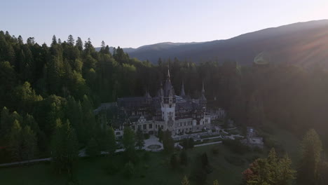 Drone-rotating-around-the-Peles-Castle-nestled-in-the-Carpathian-Mountains