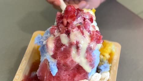 People-Eating-Delicious-Hawaiian-Shaved-Ice;-Close-up