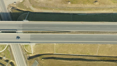 Aerial-view-of-vehicles-on-an-overpass-with-intersecting-roads-below