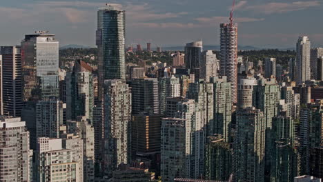 Vancouver-BC-Canada-Aerial-v48-zoomed-drone-flyover-metropolitan-area-capturing-downtown-cityscape-with-skyscrapers-of-commercial-and-residential-buildings---Shot-with-Mavic-3-Pro-Cine---July-2023