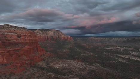 Cloudy-Sky-Over-Red-Rocks-Of-Sedona-In-Arizona---Drone-Shot