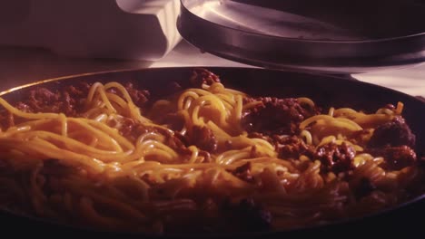 Hot-spaghetti-bolognese-with-meat-and-tomato-sauce-in-a-pan-on-the-stove