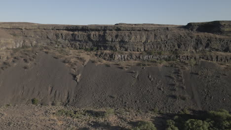 AERIAL-DRONE-SHOT-OF-SUN-LAKE-DRY-FALLS-CLIFF-SIDE