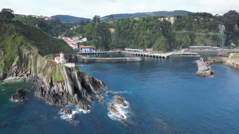 Cudillero-Lighthouse-and-Coastal-Village-in-Asturias,-North-Spain---Aerial-4k