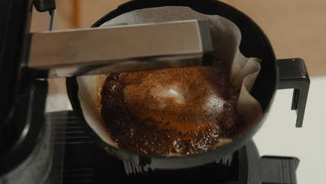 Fresh-coffee-brewing-in-modern-drip-machine-close-up