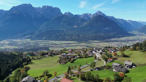 Gaital-Alps-and-Small-Mountain-Village-near-Lienz-in-Tyrol,-Austria---Aerial-4k