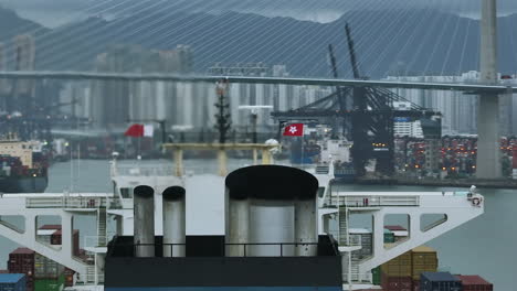 Hot-chimney-on-top-of-asian-Container-Ship-in-Hong-Kong-City