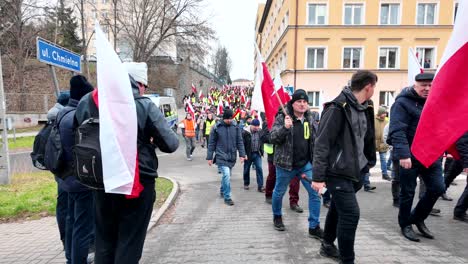 People-are-protesting,-the-crowd-is-walking-through-the-city-center