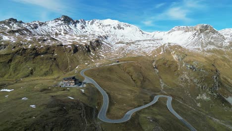 Grossglockner-High-Alpine-Road-and-Snowy-Mountains-in-Austria-Alps---Aerial-4k-Circling