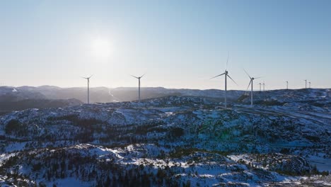 Winter-Scene-Of-A-Wind-Turbines-Over-Ridges-Near-Bessaker,-Norway