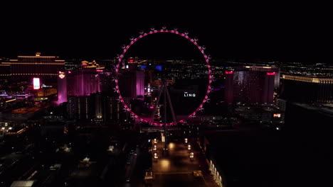 Las-Vegas-NV-USA,-High-Roller-Ferris-Wheel-and-The-Linq-Hotel-Casino-at-Night,-Aerial-View