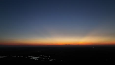Twilight-hues-over-Arauca,-Colombia-with-a-lone-star-in-the-sky,-aerial-shot