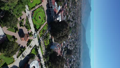 Oaxaca-Mexico-Tule-Tree-overview,-vertical-aerial-shot-from-above,-great-weather-mountain-skyline