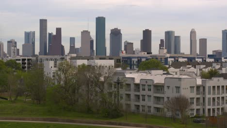 Moving-forward-drone-shot-of-downtown-Houston-and-town-homes