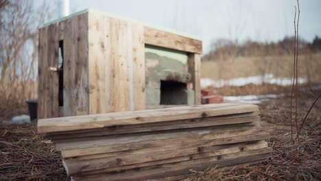 Man-Preparing-Woods-Needed-For-His-DIY-Hot-Tub---Close-Up