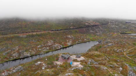 Aerial:-ore-train-in-Søsterbekk-stasjon,-close-to-the-border-between-Sweden-and-Norway-in-north-Lapland