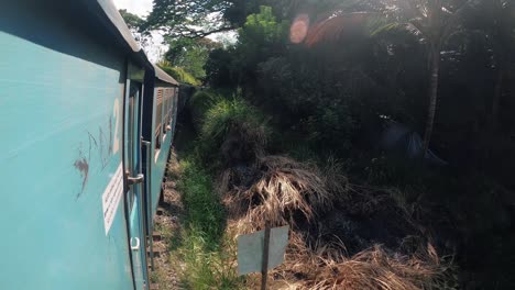 Train-moves-through-green-meadows.-Ella,-Sri-Lanka