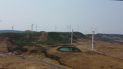 drone-filming-wind-turbines-above-the-hills