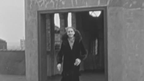 Smiling-Woman-in-Fur-Coat-on-Rooftop-of-Building-in-New-York-in-1930s