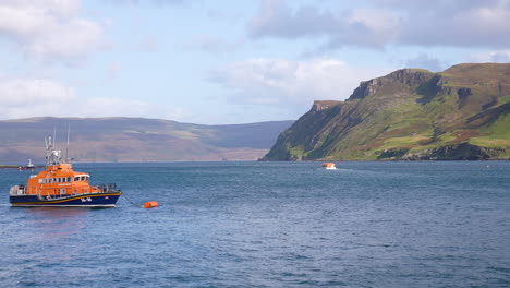 Portree,-Isle-of-Skye,-Scotland-UK,-Fishing-Boat-and-Scenic-Coastline-on-Sunny-Day