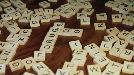 Crossword-tile-letters-added-to-word-DRUGS-to-form-GOOD-DRUGS,-closeup
