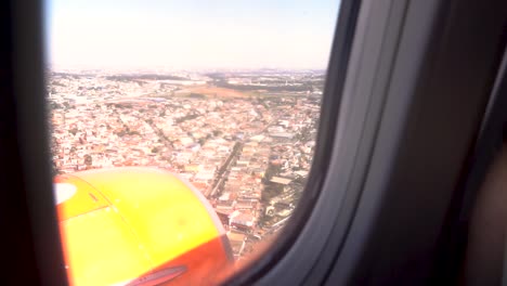 Airplane-Window-View-of-Sao-Paulo-city,-Brazil