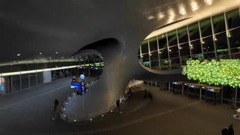 Arnhem-central-bus-and-train-station-hall-at-night-crane-down-indoors