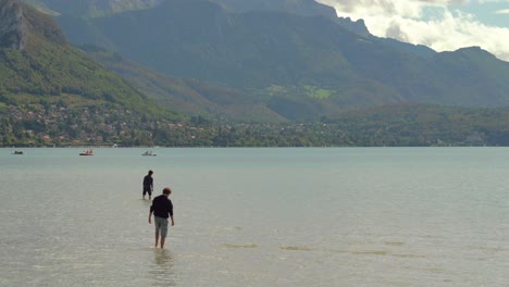 Two-French-Men-Walking-on-the-Shore-of-Annecy-lake