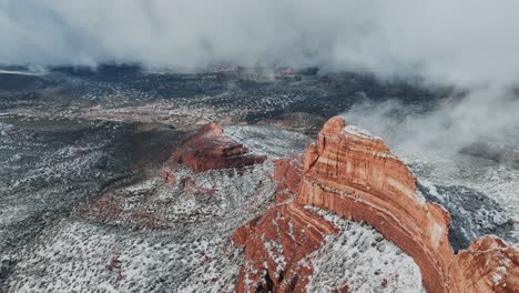 Aerial-Of-Desert-Red-Rock-Formation-With-Low-Clouds-During-Winter-In-Sedona,-Arizona