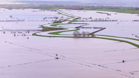 Drone-view-of-countryside-flooding-around-River-Tone,-Somerset,-UK