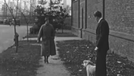 Man-Walks-His-Dog-Down-a-Neighborhood-Street-in-New-York-in-the-1930s