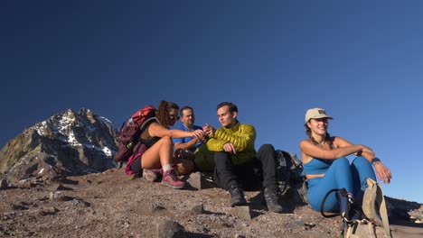 Group-Of-Hikers-Sitting-On-Mountain-In-Garibaldi-Provincial-Park,-British-Columbia,-Canada