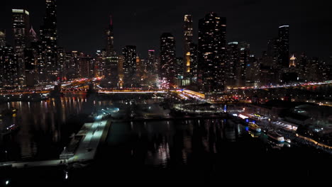 Aerial-tracking-shot-of-Valentine's-Day-Fireworks-on-the-waterfront-of-Chicago