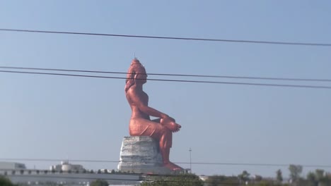 pov-shot-Many-big-idols-of-Shivaji-are-visible-and-there-are-also-many-trees