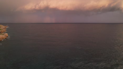 Stormy-Rainy-Clouds-over-the-Ocean-in-Santo-Domingo-City-Coast,-Pan-View