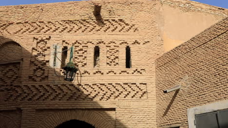Sunlit-ancient-Arabic-street-in-Sbeitla-with-intricate-brickwork