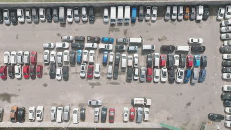 Drone-shot-of-cars-at-a-parking-lot