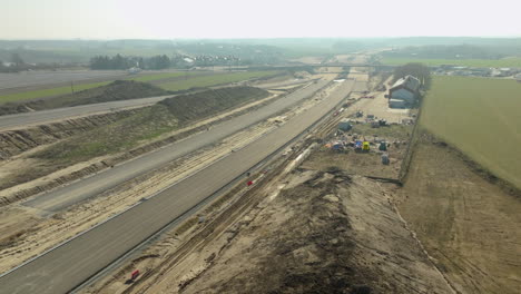 Aerial-view-of-a-highway-under-construction-with-work-zones-and-equipment