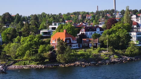Aerial-View-of-Upscale-Residential-Neighborhood-in-Fjord-Near-Stockholm,-Sweden-on-Sunny-Summer-Day
