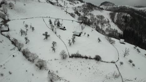 Journeying-through-time-and-tradition-among-the-snow-kissed-Cindrel-Mountains,-amidst-the-enduring-charm-of-old-houses