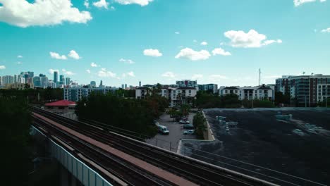 Revealing-Miami-skyline-behind-elevated-rail-tracks