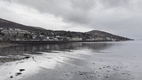 Fort-William-Scotland-seen-from-the-shore-of-Loch-Eil-on-a-calm-winter-day