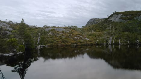 Low-angle-view-of-a-pond-with-hills-at-background